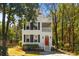 Attractive exterior of two-story home featuring a bright red front door at 1100 Sea Island Crossing Ln, Mount Pleasant, SC 29464