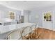 Kitchen features island with seating, stainless appliances, and access to outdoor space at 1100 Sea Island Crossing Ln, Mount Pleasant, SC 29464