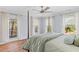 Main bedroom with private balcony, large windows, and neutral decor at 1100 Sea Island Crossing Ln, Mount Pleasant, SC 29464