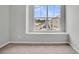 Bedroom featuring carpet, large window offering a view of the neighborhood, and base trim at 112 Brown Swiss Cir, Summerville, SC 29483