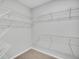 Walk-in closet with carpeted floor and multiple wire shelving units for maximum storage at 112 Brown Swiss Cir, Summerville, SC 29483