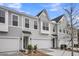 Charming new construction townhomes featuring attached garages and gray siding at 112 Brown Swiss Cir, Summerville, SC 29483