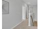 Upstairs hallway featuring neutral paint, carpet, and views of multiple entryways at 112 Brown Swiss Cir, Summerville, SC 29483