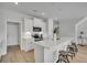 Stylish kitchen with white cabinets, quartz countertops, and a large center island at 112 Brown Swiss Cir, Summerville, SC 29483