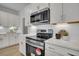 Close-up of a well-equipped kitchen with stainless steel appliances and white subway tile backsplash at 112 Brown Swiss Cir, Summerville, SC 29483