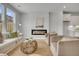 Inviting living area featuring a stylish fireplace, neutral tones, and a cozy jute rug at 112 Brown Swiss Cir, Summerville, SC 29483