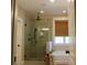 Modern bathroom featuring a glass-enclosed shower, a bathtub, and stylish fixtures for a relaxing experience at 112 Carpenter St, Summerville, SC 29486