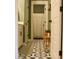 Charming bathroom with decorative tile, white vanity, and bench with natural light at 112 Carpenter St, Summerville, SC 29486