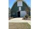 Exterior view of the community barn with flowers and garden beds at 112 Carpenter St, Summerville, SC 29486