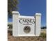 Carnes Crossroads entrance sign with a brick base and landscaped flower beds at 112 Carpenter St, Summerville, SC 29486