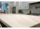 Bright kitchen featuring light countertops, and a view of stainless appliances and white cabinets at 112 Carpenter St, Summerville, SC 29486