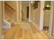 Inviting hallway with hardwood floors, neutral walls, and doorways leading to other rooms at 112 Carpenter St, Summerville, SC 29486