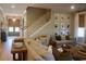 Comfortable living room with staircase, natural light, and stylish decor and wood flooring at 112 Carpenter St, Summerville, SC 29486