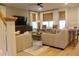 Inviting living room with hardwood floors, comfortable seating, and large windows offering plenty of natural light at 112 Carpenter St, Summerville, SC 29486