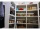 Organized pantry shelves with various food containers and cooking supplies in a well-lit space at 112 Carpenter St, Summerville, SC 29486