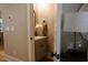 Stylish powder room with patterned wallpaper, modern vanity, and tasteful decor, offering a touch of elegance at 112 Carpenter St, Summerville, SC 29486