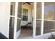 Inviting screened porch with comfortable outdoor seating, ceiling fan, and peaceful atmosphere at 112 Carpenter St, Summerville, SC 29486