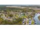 Community aerial view featuring beautiful homes nestled among lush greenery, a pond, and waterfront access at 1149 Lands End Dr, Hanahan, SC 29410