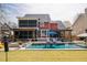 This backyard features a sparkling pool, outdoor kitchen and hot tub, creating the perfect outdoor retreat at 1149 Lands End Dr, Hanahan, SC 29410
