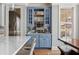 A cozy bar area featuring a mirrored backsplash, shelving, and storage at 1149 Lands End Dr, Hanahan, SC 29410