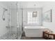 Walk-in shower and soaking tub feature chrome fixtures and marble-style surround at 1149 Lands End Dr, Hanahan, SC 29410