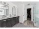 Bathroom with double vanity, shiplap walls, and glass-enclosed shower at 1149 Lands End Dr, Hanahan, SC 29410