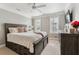 Comfortable bedroom with a ceiling fan, plush bedding, and natural light at 1149 Lands End Dr, Hanahan, SC 29410