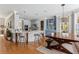 Open concept kitchen and dining area with island seating and modern chandelier at 1149 Lands End Dr, Hanahan, SC 29410