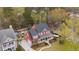 Charming red two-story home with a covered front porch and well-manicured lawn nestled in a lush, green neighborhood at 1149 Lands End Dr, Hanahan, SC 29410