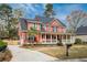 Beautiful two-story home with a covered porch, driveway, and well-maintained landscaping at 1149 Lands End Dr, Hanahan, SC 29410