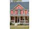 Attractive two-story home with a welcoming front porch and well-manicured lawn at 1149 Lands End Dr, Hanahan, SC 29410