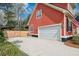 A red house with a garage and outdoor shower area at 1149 Lands End Dr, Hanahan, SC 29410