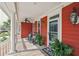 Charming front porch with rocking chairs, a ceiling fan, and decorative outdoor lighting features at 1149 Lands End Dr, Hanahan, SC 29410