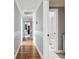 Elegant hallway with hardwood floors and decorative molding leading to a bedroom and bathroom at 1149 Lands End Dr, Hanahan, SC 29410