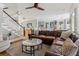 Open-concept living area seamlessly connecting to a modern kitchen and showcasing hardwood floors at 1149 Lands End Dr, Hanahan, SC 29410