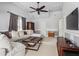 A bright living room with a ceiling fan and comfortable sectional sofa with a unique coffee table at 1149 Lands End Dr, Hanahan, SC 29410