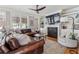 Spacious living room with comfortable leather seating, built-in shelving, and a modern fireplace at 1149 Lands End Dr, Hanahan, SC 29410