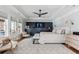 Bright main bedroom featuring tray ceilings, ceiling fan, ensuite bath access, and lots of natural light at 1149 Lands End Dr, Hanahan, SC 29410
