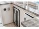 Granite countertop, wine cooler, and stainless steel refrigerator in the outdoor kitchen area at 1149 Lands End Dr, Hanahan, SC 29410