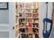 Walk-in pantry with custom shelving, offering ample storage for groceries and kitchen essentials at 1149 Lands End Dr, Hanahan, SC 29410