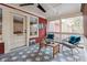 Inviting screened-in patio featuring stylish seating and a geometric patterned rug at 1149 Lands End Dr, Hanahan, SC 29410
