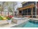 Backyard pool and patio with a covered outdoor seating and entertainment area at 1149 Lands End Dr, Hanahan, SC 29410