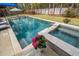 Sparkling pool and hot tub with lush landscaping, creating a private backyard oasis at 1149 Lands End Dr, Hanahan, SC 29410