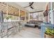 Relaxing screened porch with outdoor seating and ceiling fans at 1149 Lands End Dr, Hanahan, SC 29410