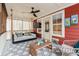 Enclosed sunroom with daybed and ceiling fan at 1149 Lands End Dr, Hanahan, SC 29410