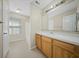 Bright bathroom features a light wood vanity, large mirror, window, and shower/tub combo at 115 Trickle Dr, Summerville, SC 29483