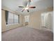 Spacious bedroom features carpet flooring, a ceiling fan, and natural light from a window at 115 Trickle Dr, Summerville, SC 29483