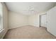 This cozy bedroom features neutral walls, carpet, a ceiling fan, and a closet at 115 Trickle Dr, Summerville, SC 29483