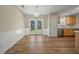Bright dining area with hardwood floors, white wainscoting, and French doors leading to the backyard at 115 Trickle Dr, Summerville, SC 29483