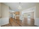 Bright kitchen featuring wood floors, cabinets, a white refrigerator, stove, and an entry to the living room at 115 Trickle Dr, Summerville, SC 29483